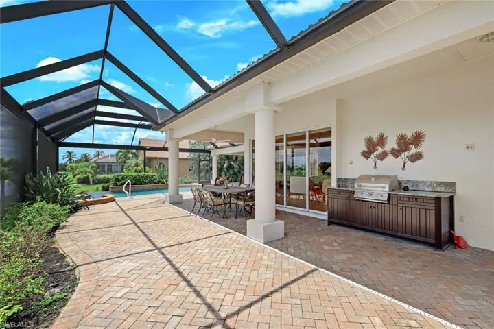 Outdoor Grilling Area- Gas Fed-Granite Counters- Separate Pool Bath is located to the Right (not shown)