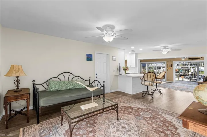 Living room with LVP flooring and views to the canal