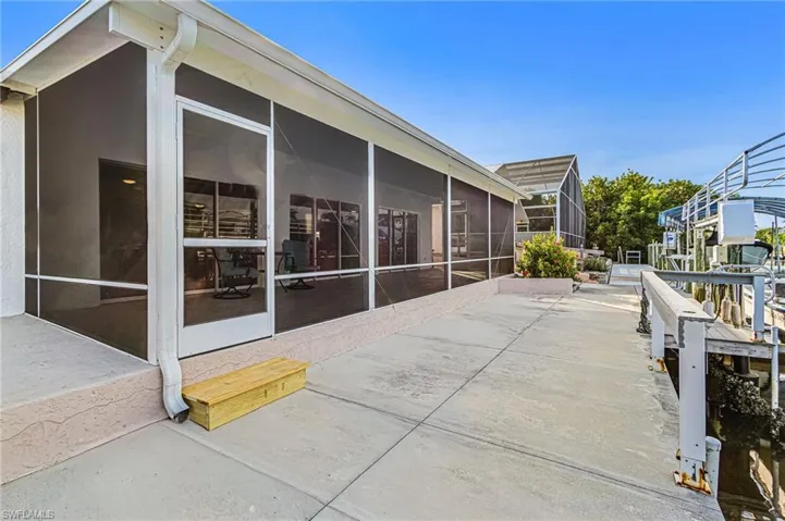 View of patio / terrace featuring a sunroom