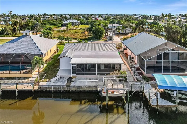 Aerial view of residential area featuring a large body of water