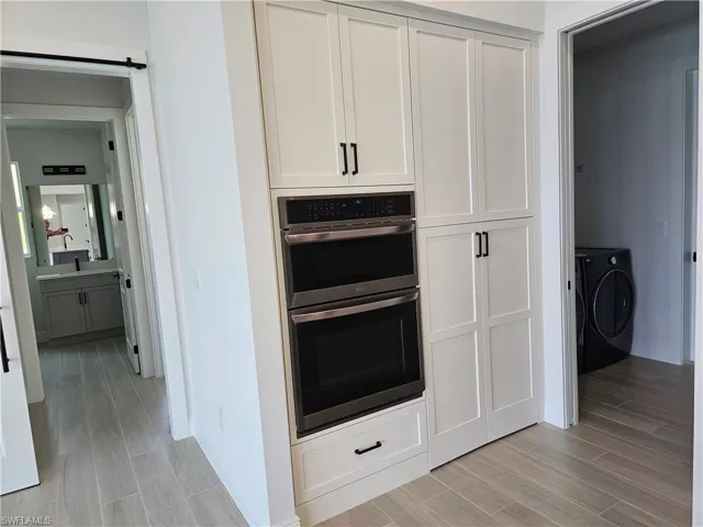 Wall Oven/Microwave combo with Air Frying feature and hidden walk-in pantry