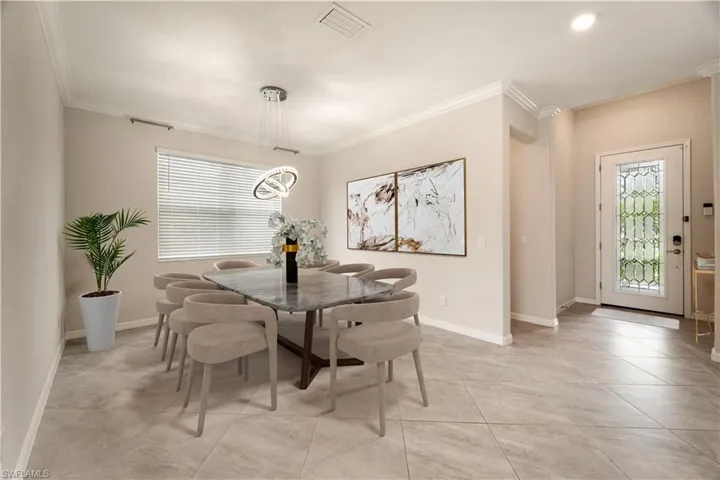 Virtually Staged Dining Room with room to seat 8+ guests