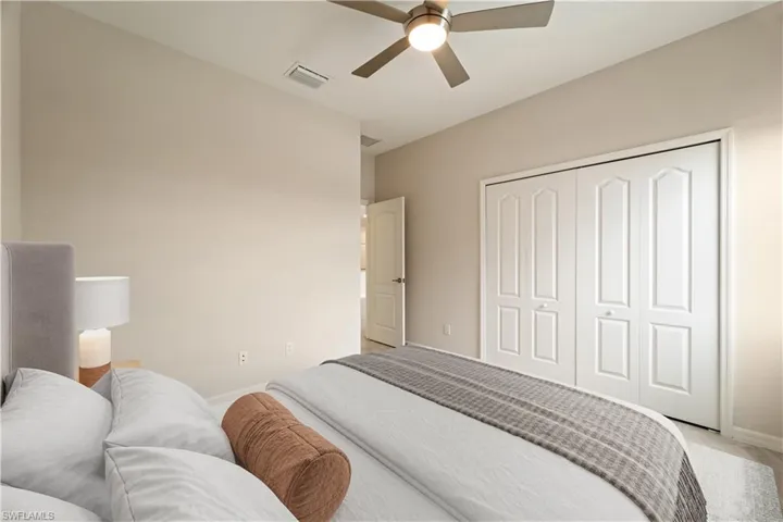 Bedroom 2 featuring a closet and ceiling fan