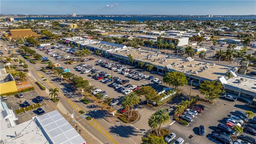 Aerial overview of property's location featuring a commercial area