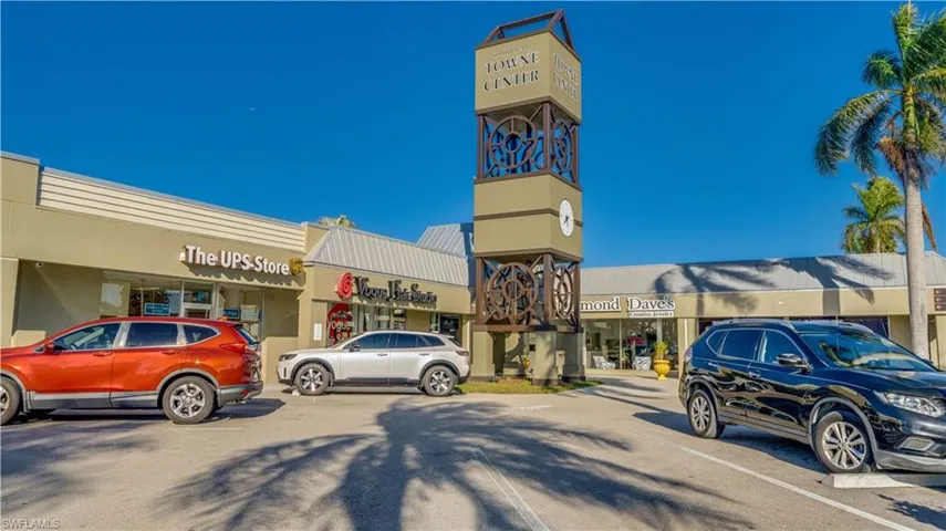 View of commercial location featuring uncovered parking