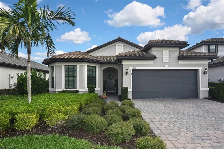 Mediterranean / spanish-style home featuring a garage