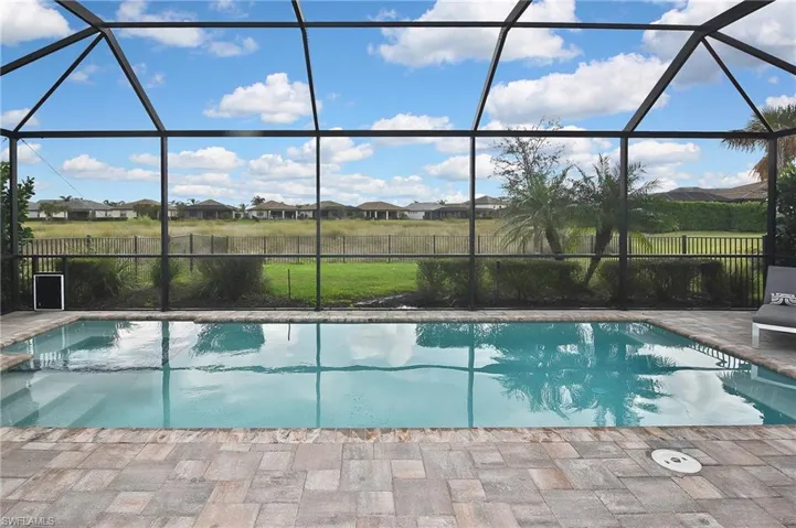 View of pool featuring a patio and a lanai