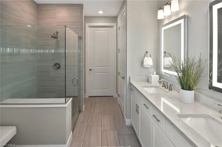 Bathroom with an enclosed shower and vanity