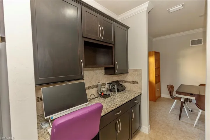 built in desk in the kitchen next to pantry