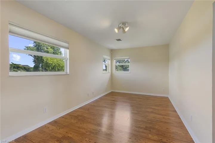Spare room with wood finished floors