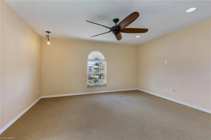 Unfurnished room with light colored carpet, ceiling fan, and recessed lighting