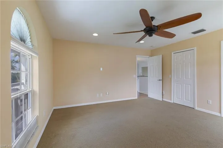 Unfurnished bedroom featuring recessed lighting, carpet, and ceiling fan