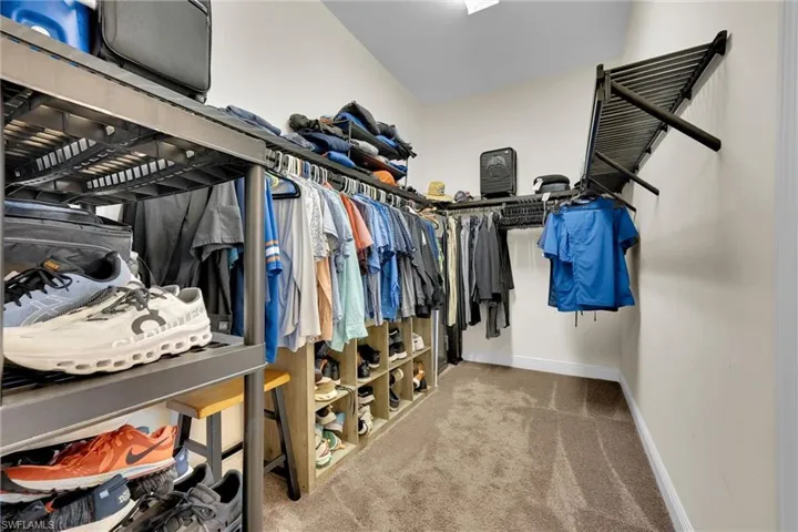 Deep Walk-in closet with access from primary bathroom