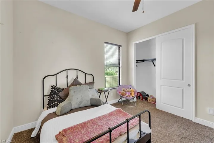 Guest Bedroom #3 with ceiling fans and closet