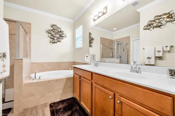 Double vanity with undermount sinks and wood-finish cabinetry