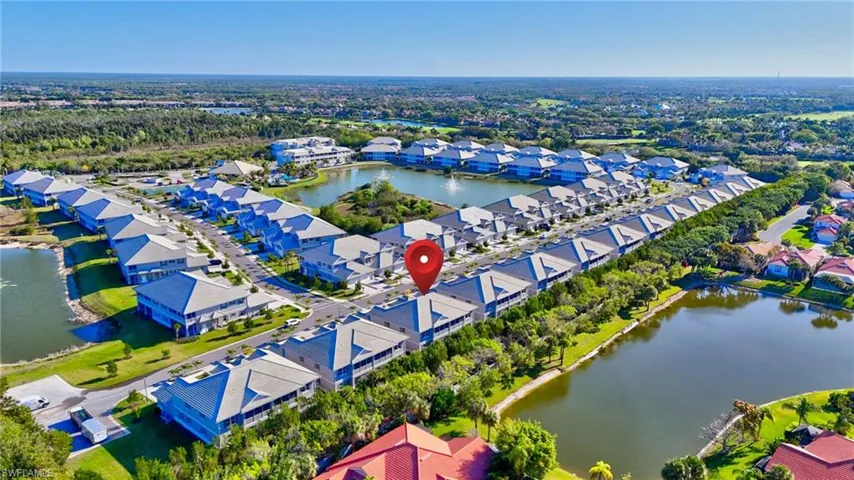 View of property location with a large body of water and nearby suburban area