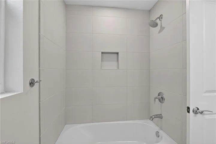 Full bath featuring  shower combination