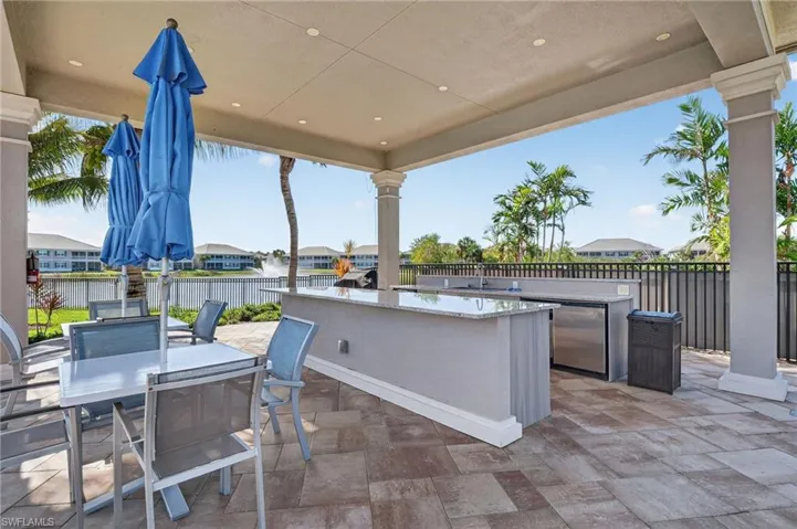 View of patio / terrace with area for grilling and a residential view