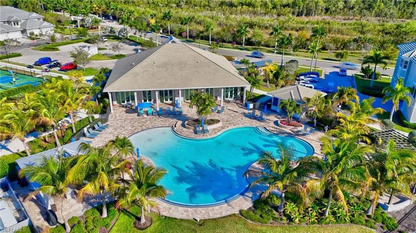 Community pool with a patio