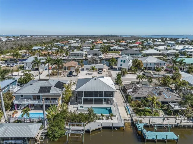 Aerial of home with Ft. Myers Beach in the background.