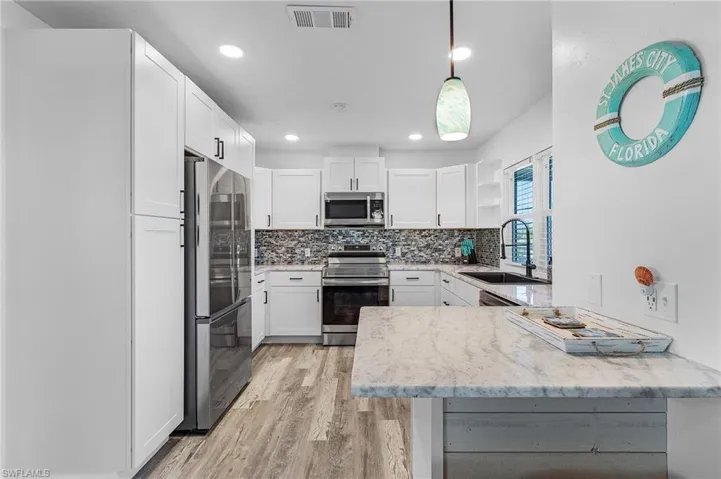 All new kitchen with granite counters and stainless appliances.
