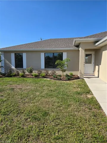 Single story home featuring a front yard