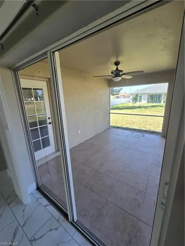 View of patio featuring ceiling fan