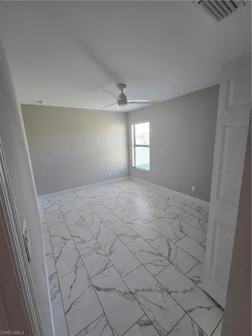 Unfurnished room with ceiling fan
