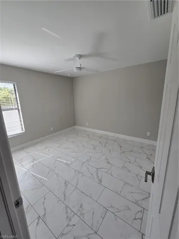 Unfurnished room with ceiling fan