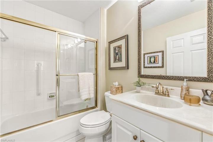 Guest bath w pocket door in hall for ensuite bath