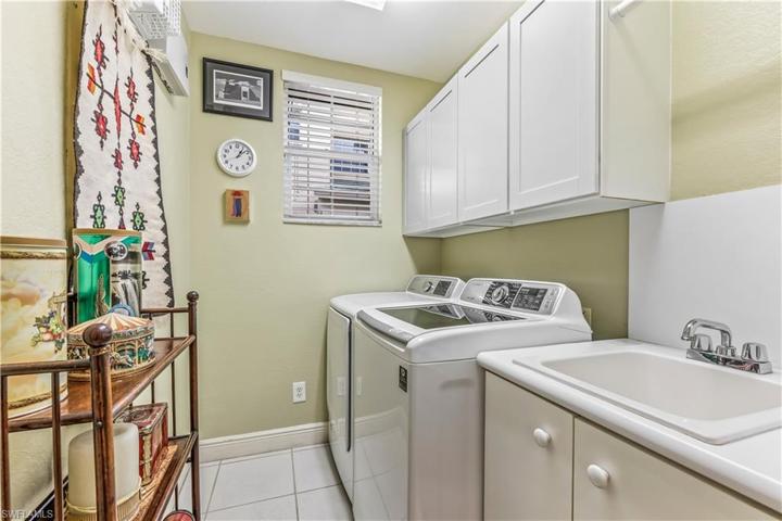Laundry room w utility sink and storage