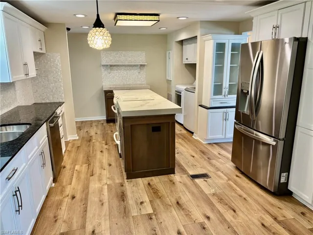 Large Kitcen with new Wood Laminate Flooring.