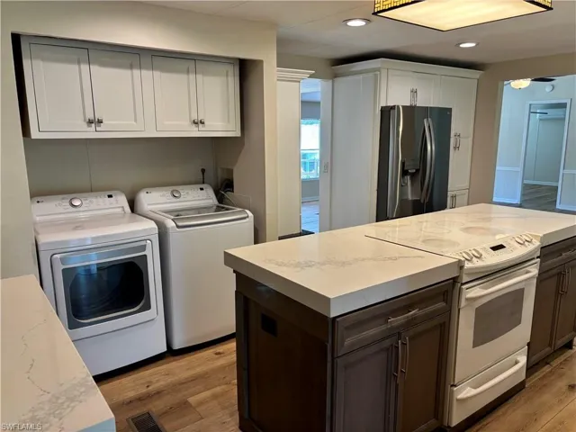 Kitchen Island has Quartz Countertops.