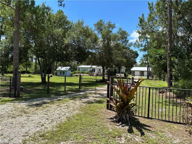 Front driveway with solar powered gate.