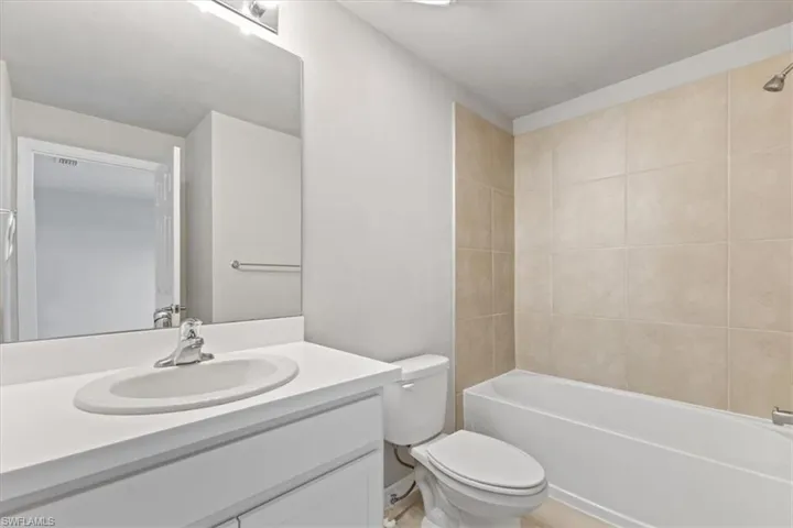 Full bathroom featuring vanity and shower / bath combination