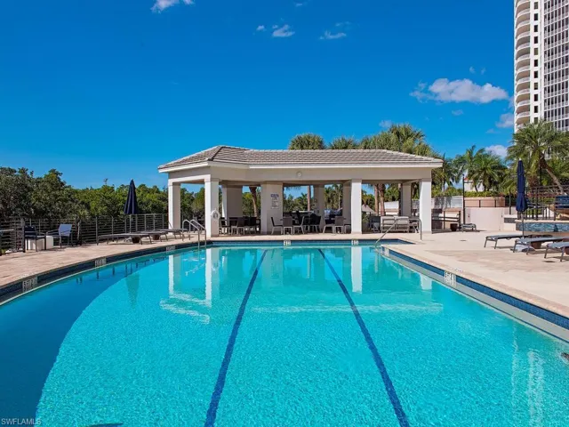 Community pool featuring a patio