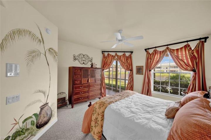 Primary bedroom has fountain and lake view