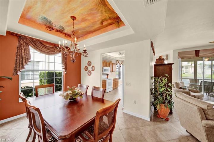 Another hand painted mural adorns the tray ceiling in the dining room