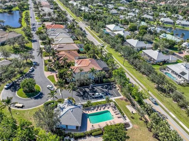 Drone / aerial view of clubhouse and pool