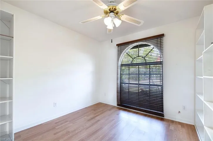 Spare room featuring ceiling fan and hardwood / wood-style floors