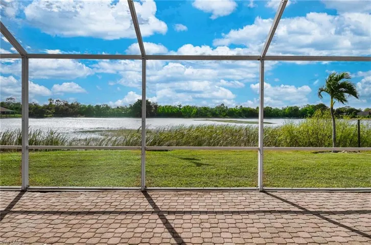 Unfurnished sunroom with a water view