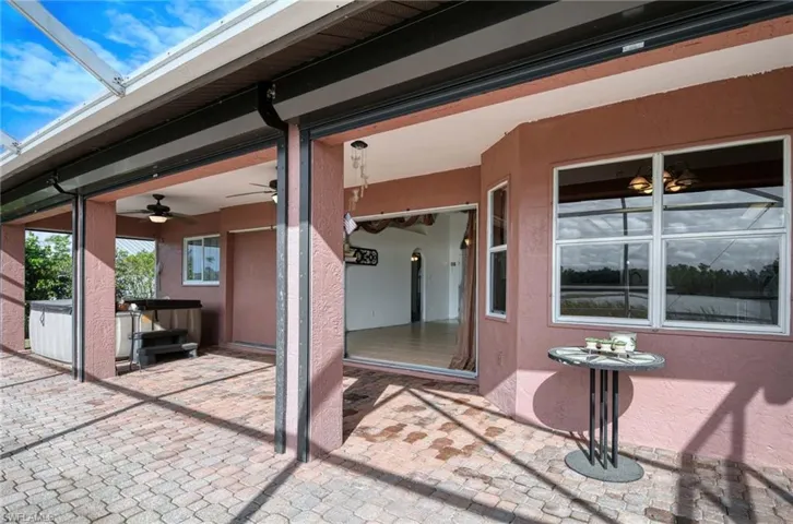 View of patio featuring ceiling fan