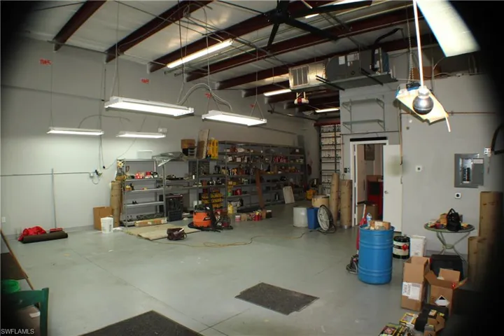 Warehouse featuring a workshop area and electric panel