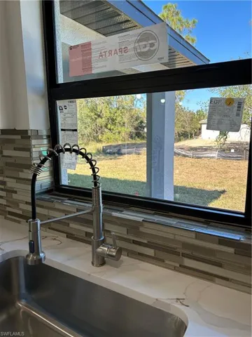Room details with backsplash and sink