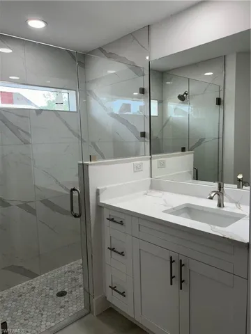 Bathroom with vanity and walk in shower