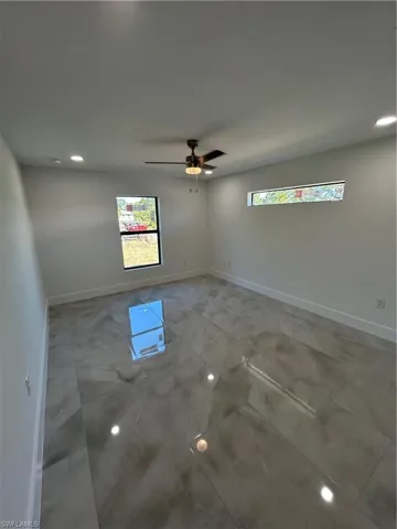 Spare room with plenty of natural light and ceiling fan