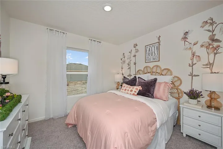 Photos are of a model home or artist rendering. Home may be virtually staged; Carpeted bedroom with a textured ceiling