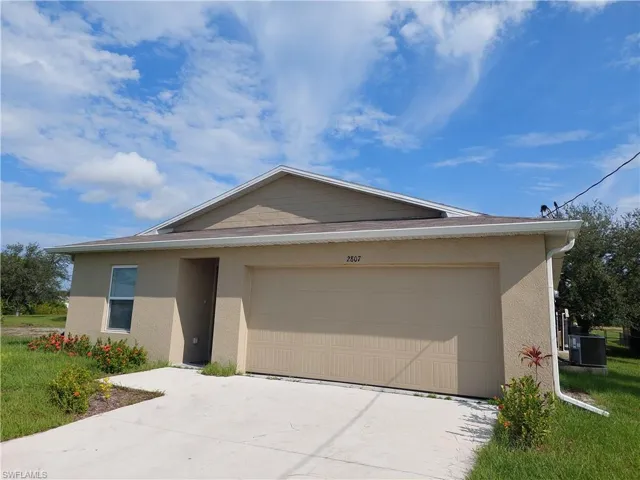 Single story home with a garage and central AC