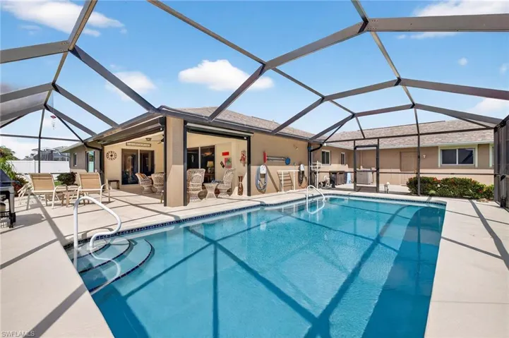 Crsytal Blue pool and Lanai area under Truss and Screened Cage