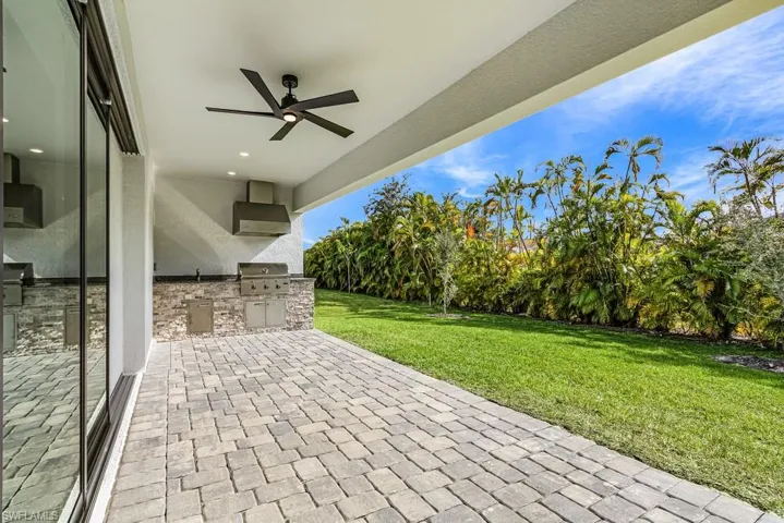 View of patio / terrace with an outdoor kitchen and ceiling fan